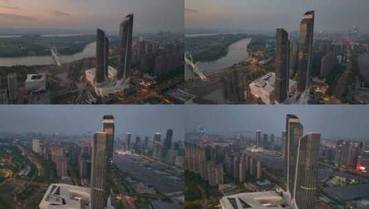 航拍落日夜幕下的南京地标双子塔建筑高清在线视频素材下载