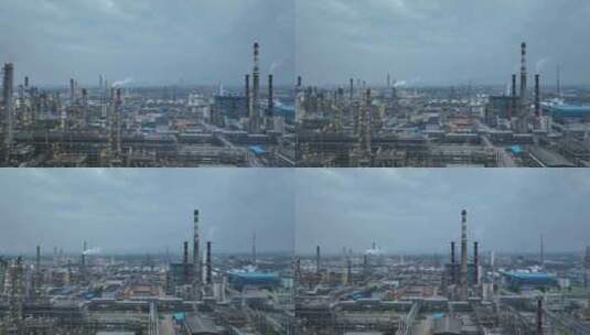 石油化工企业炼油厂傍晚亮灯时的平移航拍高清在线视频素材下载