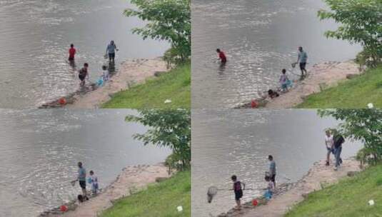 枯水期浅水区河水捞鱼游玩戏水的小朋友1高清在线视频素材下载