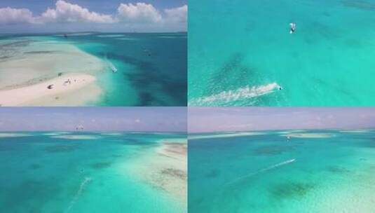 KITESURFER帆和跳跃在加勒比海蔚蓝的海，空中拍摄惊人的海景洛斯罗克斯高清在线视频素材下载