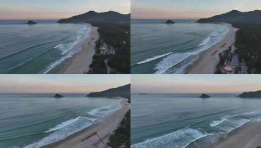 夕阳下的深圳西涌海岸线、沙滩海浪浪花航拍高清在线视频素材下载