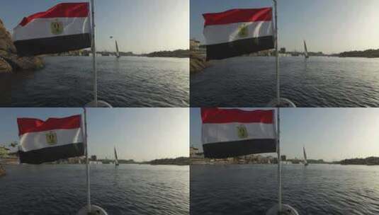 有国旗的船行驶在日落的河面上高清在线视频素材下载
