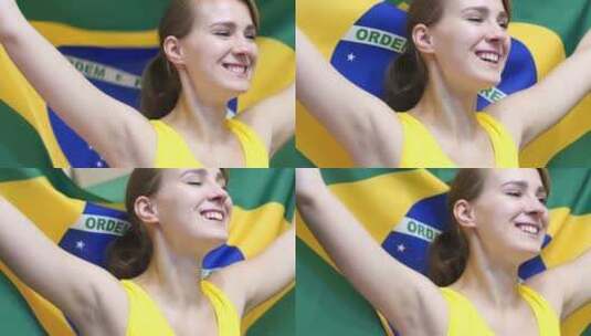 巴西年轻女子手持巴西国旗庆祝高清在线视频素材下载