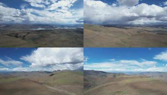 自驾西藏航拍环绕盘山无人公路蓝天白云群山高清在线视频素材下载