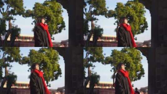 一个戴红色围巾的女人站在阳光下看远方风景高清在线视频素材下载