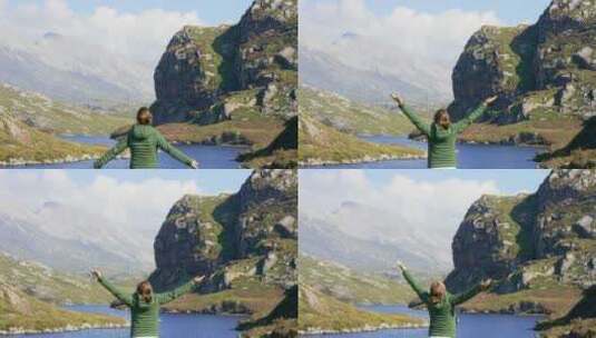 女人，后视和自由在山上与湖风景在瑞士，旅高清在线视频素材下载