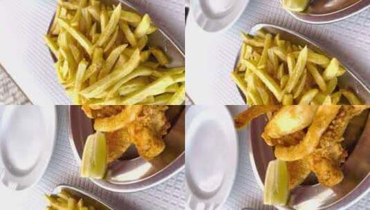 葡萄牙里斯本柠檬油炸海鲜和薯条的垂直特写高清在线视频素材下载