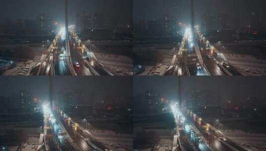 大雪夜景中车来车往的大桥交通景象高清在线视频素材下载