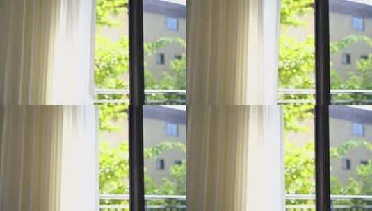 风吹窗帘窗户白色窗帘飘动阳光透过白色窗帘高清在线视频素材下载
