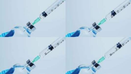 从玻璃瓶中取出疫苗的注射器高清在线视频素材下载