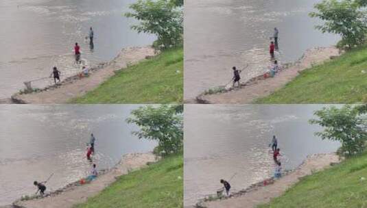 枯水期浅水区河水捞鱼游玩戏水的小朋友2高清在线视频素材下载