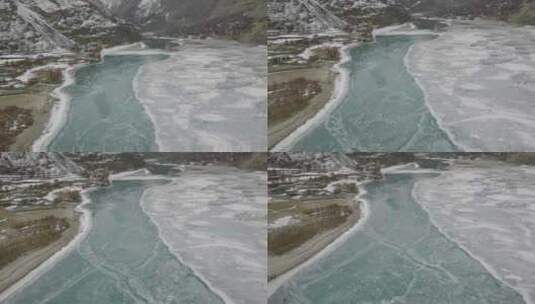 冰冻绿松石吉尔吉特河的鸟瞰图。多莉回来了，建立镜头高清在线视频素材下载
