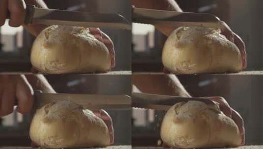 男子在厨房切面包高清在线视频素材下载