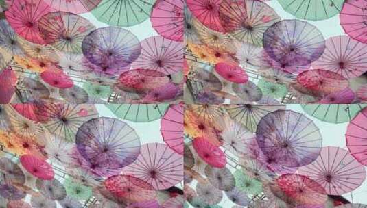 街道上挂满装饰用的中式油纸伞高清在线视频素材下载