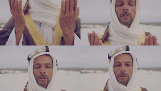 在沙漠祈祷的男人高清在线视频素材下载