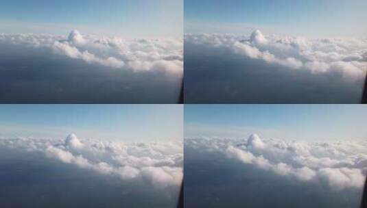 飞机飞行时窗外的云朵高清在线视频素材下载