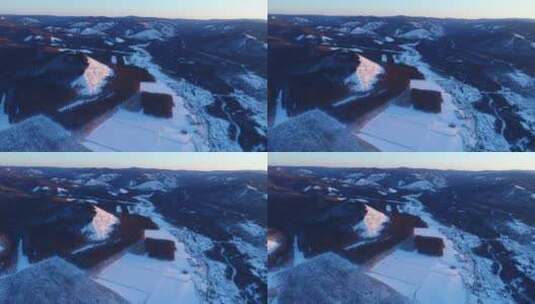 航拍呼伦贝尔冬季群山中的雪原农田高清在线视频素材下载