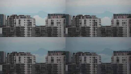 雪山下的城市云雾山峰建筑高清在线视频素材下载