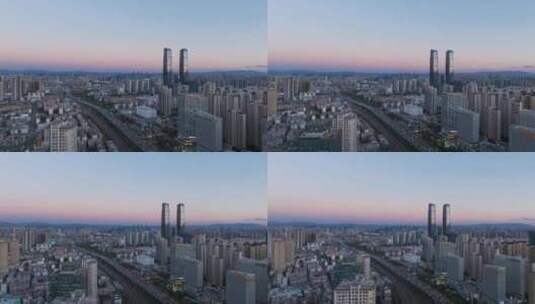 落日余晖中的昆明城市 万达双塔高清在线视频素材下载