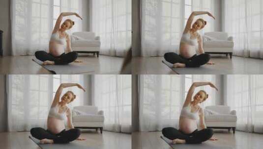 年轻孕妇在家做瑜伽大肚子孕妇练习瑜伽冥想高清在线视频素材下载