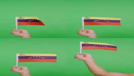 在风中挥舞时举起委内瑞拉国旗高清在线视频素材下载