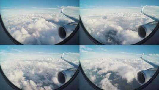 在云层上方飞行的飞机透过飞机窗看云海_4K高清在线视频素材下载