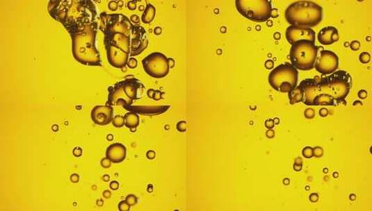 黄色背景下的气泡浮动-油高清在线视频素材下载