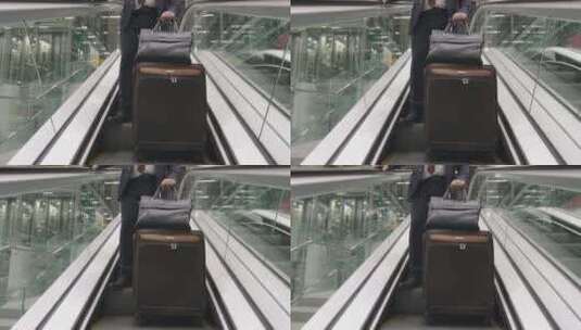 机场自动扶梯上的商人高清在线视频素材下载