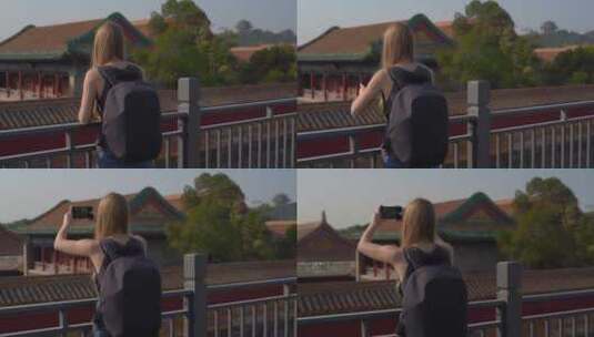 游客用手机拍摄紫禁城高清在线视频素材下载