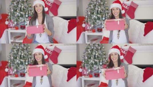 圣诞树旁的女孩拿着礼物高清在线视频素材下载
