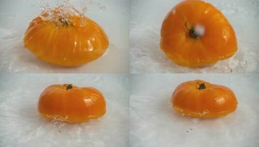 西红柿落入清水中高清在线视频素材下载