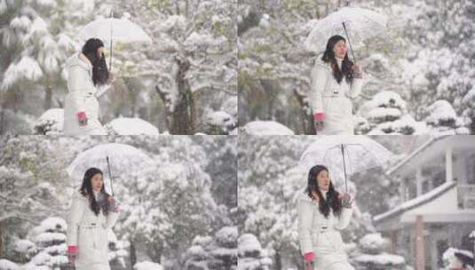 大雪纷飞打伞的女孩美女走路高清在线视频素材下载