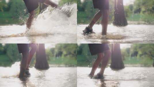 男孩在池塘用脚踢起水花飞溅4k慢镜头高清在线视频素材下载