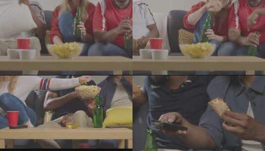 激动的球迷看球吃零食高清在线视频素材下载