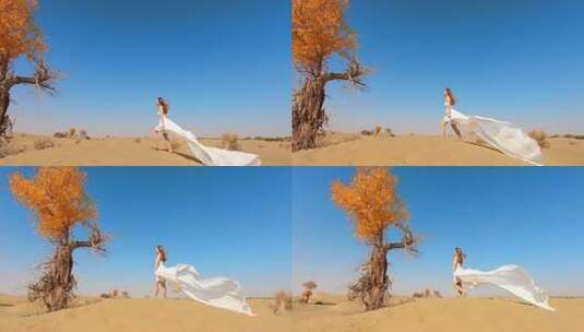 穿着白色长裙的美女行走在沙漠里高清在线视频素材下载