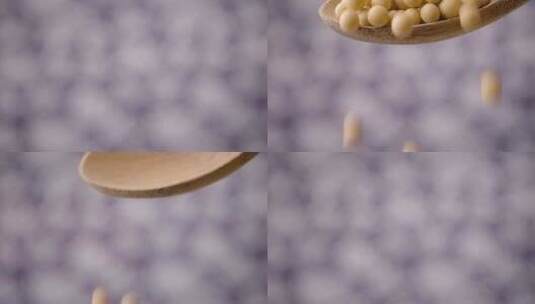 黄豆大豆从勺子里掉落高清在线视频素材下载