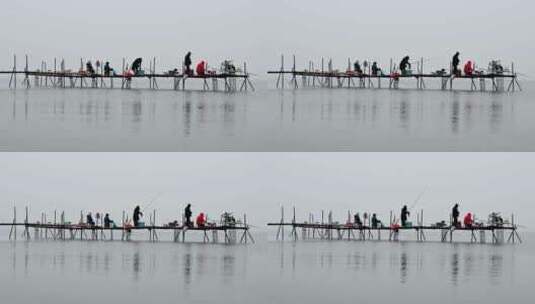 晚秋早晨湖面雾气与钓鱼人水墨画倒影高清在线视频素材下载