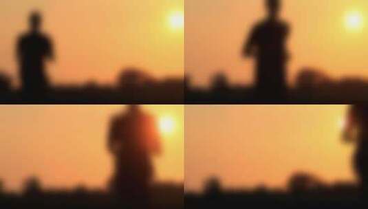 夕阳下男人奔跑的剪影高清在线视频素材下载