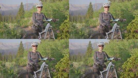 山地自行车手站在森林的小路上高清在线视频素材下载