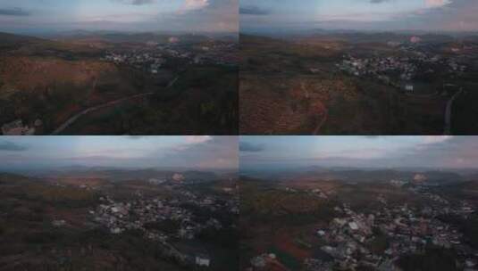 农村视频黄昏落日时的云南农村和发电风车高清在线视频素材下载