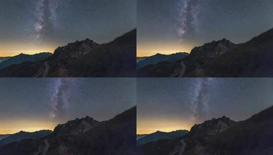 巍峨的山峰公路 浩瀚的银河星空高清在线视频素材下载