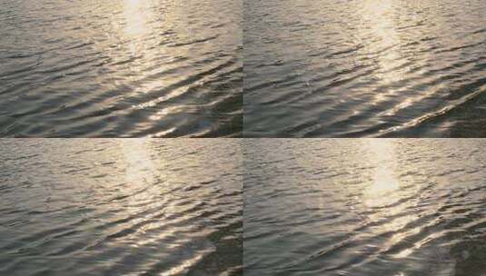 傍晚金色阳光洒在水面上波光粼粼的慢镜头高清在线视频素材下载