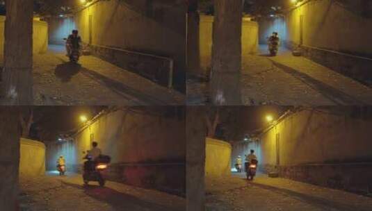 夜晚巷子里路过的摩托车高清在线视频素材下载
