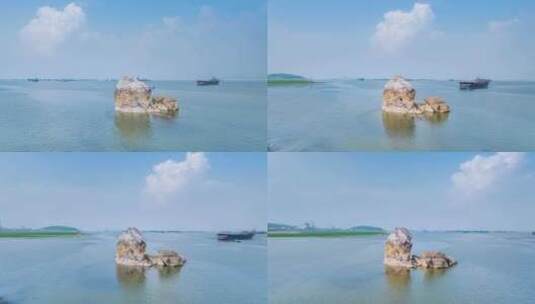 鄱阳湖蛤蟆石环绕航拍延时高清在线视频素材下载
