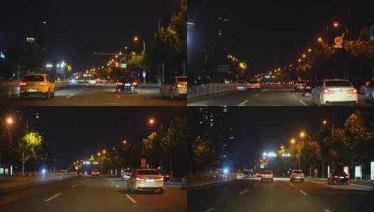 夜间开车行驶在城市道路夜晚城市车窗外风景高清在线视频素材下载