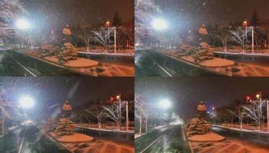航拍鉴真路扬州雪景夜景鉴真像飘雪高清在线视频素材下载