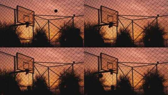日落时在篮球场上投球高清在线视频素材下载