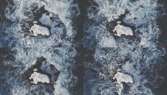 南极洲海洋中的孤零零的雪岩。航拍高清在线视频素材下载