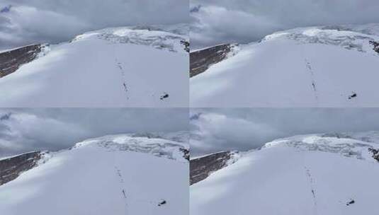 航拍攀登慕士塔格峰雪山冰川的登山队高清在线视频素材下载