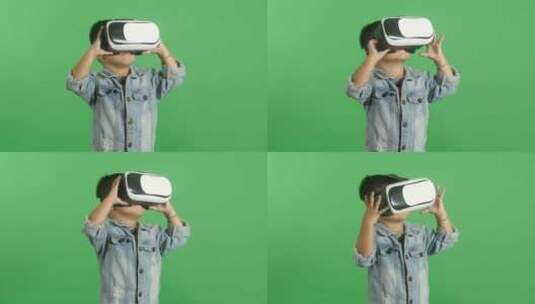 戴虚拟现实眼镜的小男孩绿屏高清在线视频素材下载